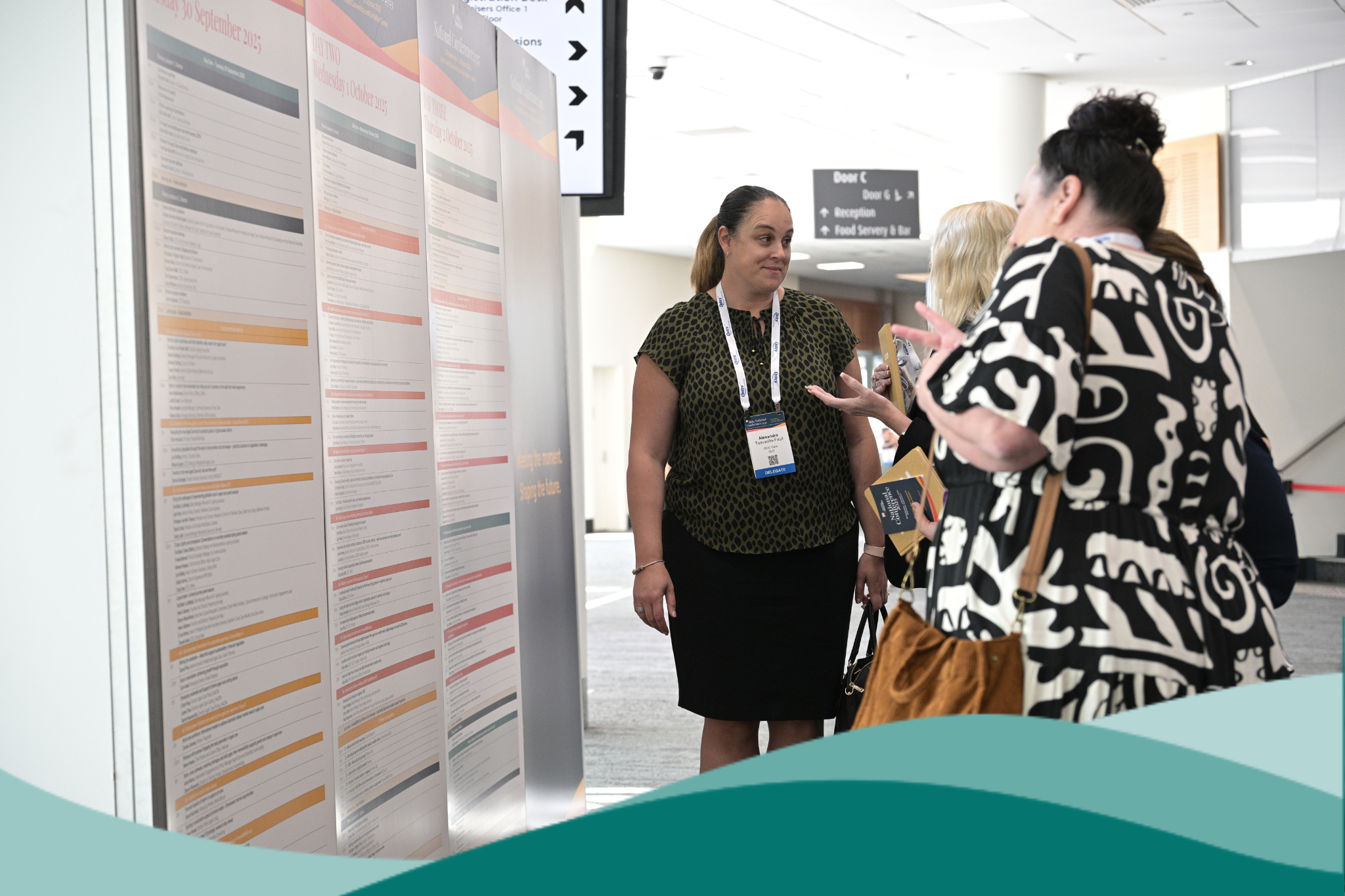 2025 National Conference 3 People Infront of Program Board