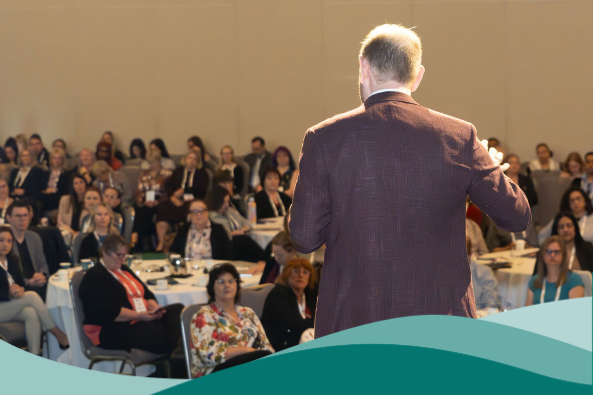 2025 WA State Conference Tom Symondson Speaking Photo With Teal Waves